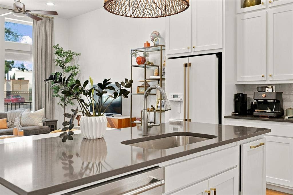 1137 Manderly Court, Dallas, TX 75204 Kitchen island with undermount sink and gooseneck faucet