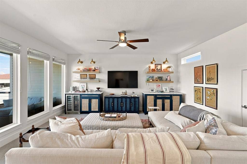 1137 Manderly Court, Dallas, TX 75204 Recessed lighting, ceiling fan, multiple windows, built-in cabinetry, and floating shelves