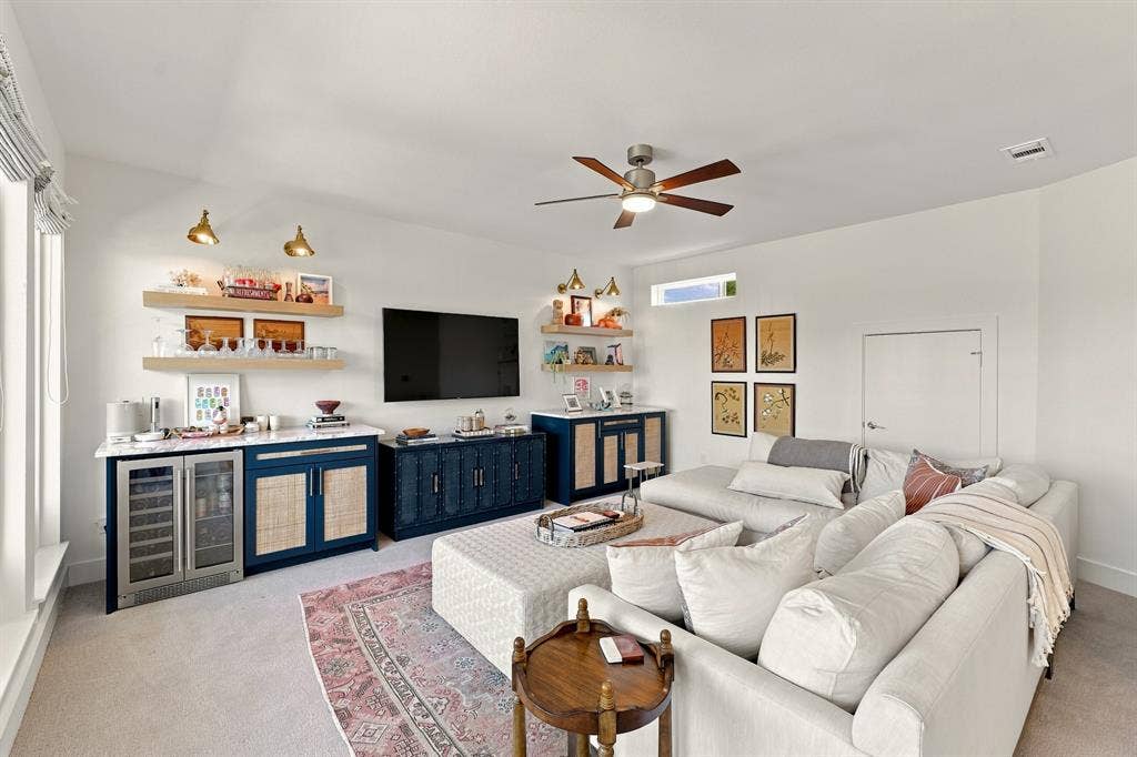 1137 Manderly Court, Dallas, TX 75204 Built-in beverage bar with countertop, dual beverage coolers, and cabinetry