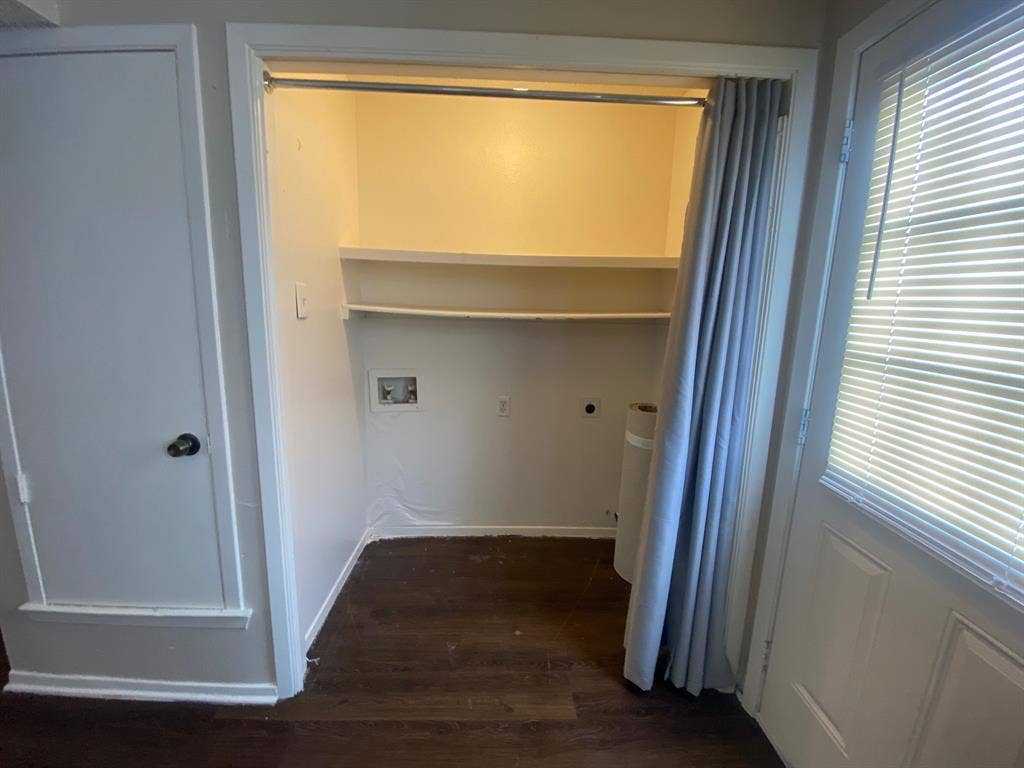 2802 Wimbledon Court, #B, Garland, TX 75041 Laundry room featuring wood finished floors, laundry area, plenty of natural light, electric dryer hookup, and washer hookup