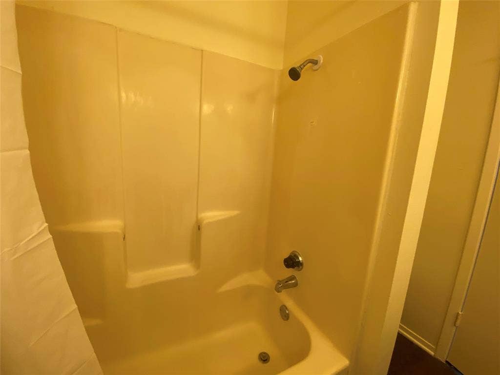 2802 Wimbledon Court, #B, Garland, TX 75041 Full bathroom featuring bathing tub / shower combination