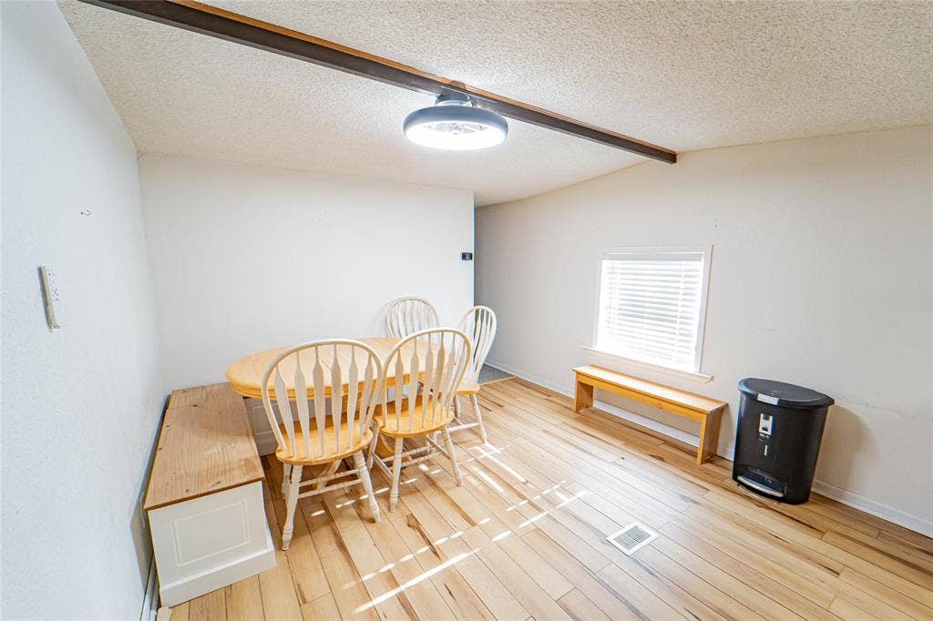 Hardwood-finish flooring, recessed lighting, and a window with blinds
