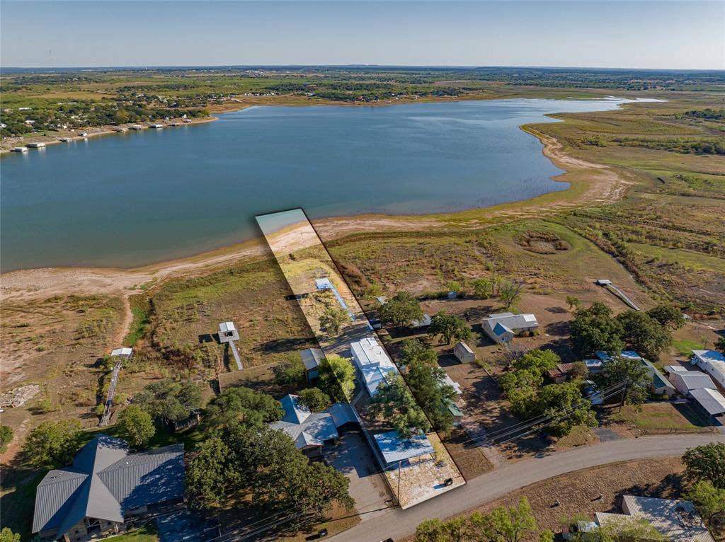 Waterfront property with private shoreline access and multiple mature trees