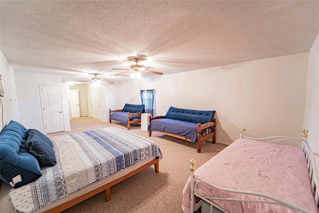Wall-to-wall carpeting and multiple ceiling fans