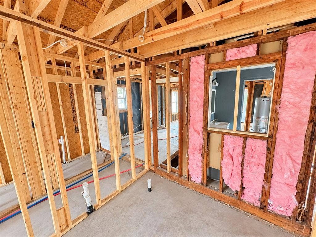 4604 Avenue H, Fort Worth, TX 76105 Exposed wood framing, visible plumbing lines, and attic trusses