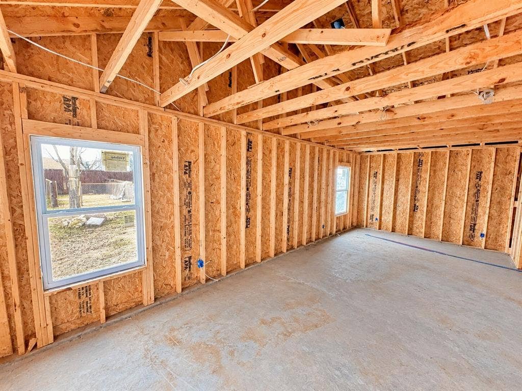 4604 Avenue H, Fort Worth, TX 76105 Exposed wood framing, durable concrete flooring, and multiple windows