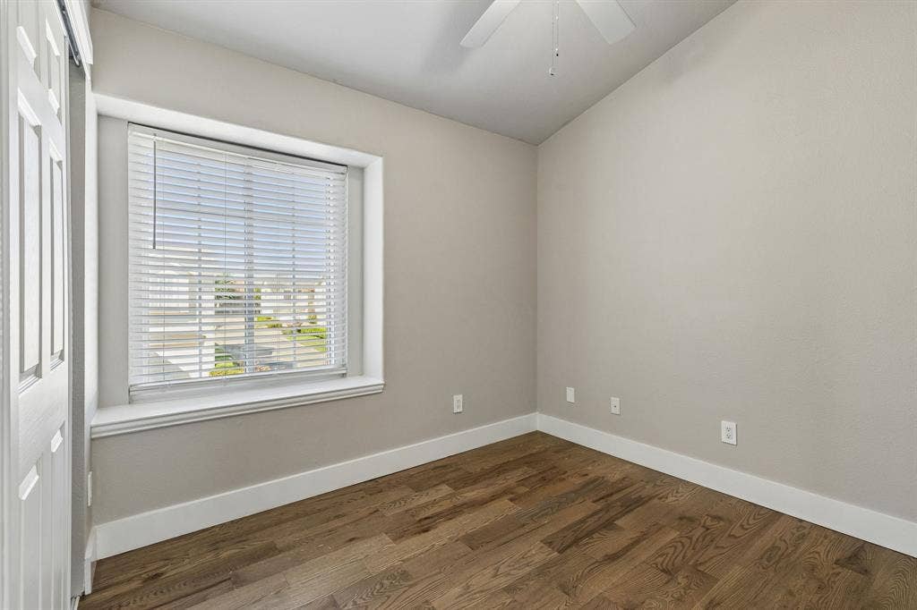 706 S Jupiter Road, #307, Allen, TX 75002 Hardwood flooring, window with blinds, ceiling fan, and white trim