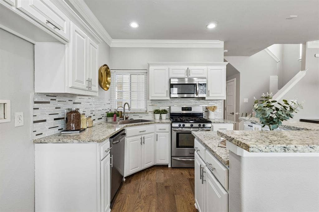 706 S Jupiter Road, #307, Allen, TX 75002 White cabinetry with brushed nickel hardware, mosaic tile backsplash
