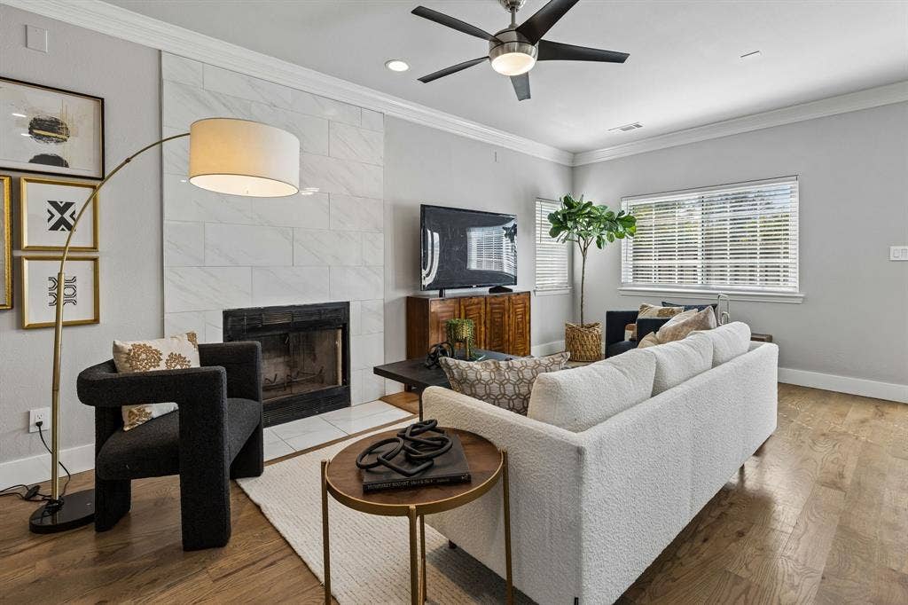 706 S Jupiter Road, #307, Allen, TX 75002 Recessed lighting, crown molding, a ceiling fan, and a fireplace with a tile surround