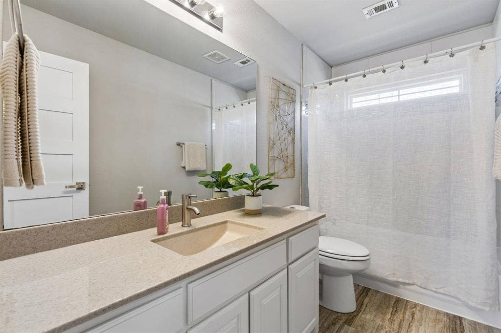 706 S Jupiter Road, #307, Allen, TX 75002 Shared bathroom with a tub