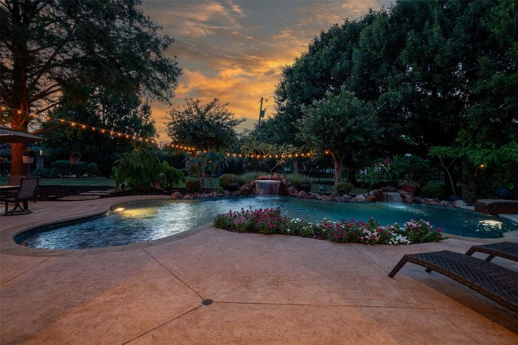 15600 Big Horn Trail, Frisco, TX 75035 Expansive custom pool with integrated spa and rock waterfall features