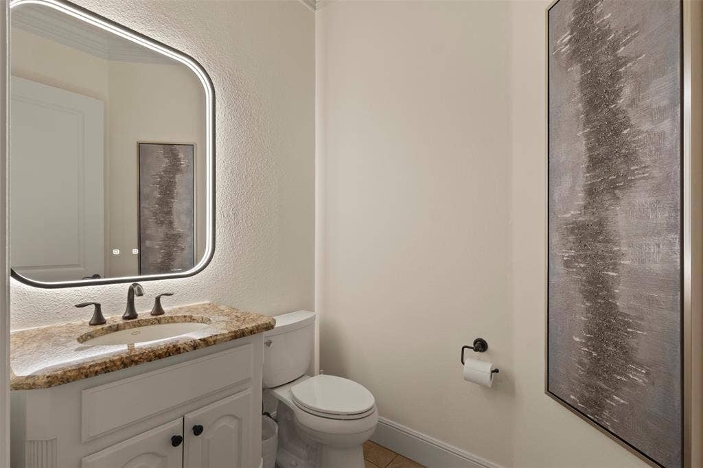 15600 Big Horn Trail, Frisco, TX 75035 White vanity with a granite countertop and an undermount sink