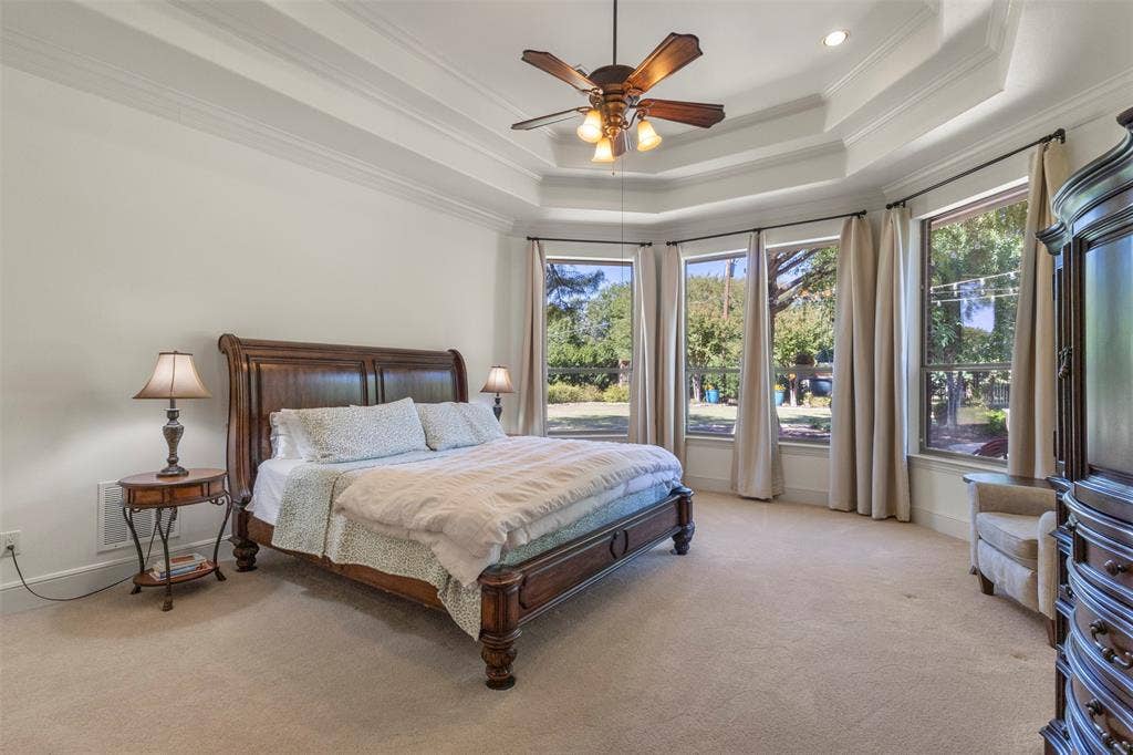 15600 Big Horn Trail, Frisco, TX 75035 Tray ceiling with crown molding, ceiling fan, recessed lighting, wall-to-wall carpeting, and a bay window configuration