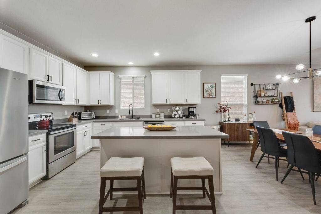 313 Citrus Drive, Fate, TX 75189 Virtually staged. Large kitchen island and Stainless-steel appliance.