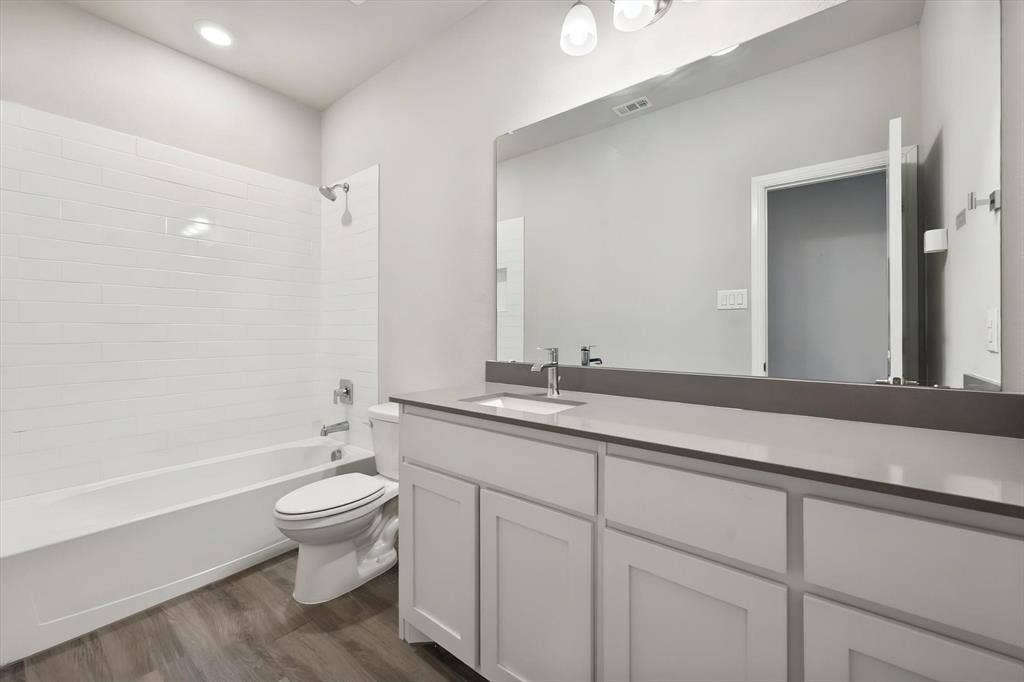 3636 Wintergreen Street, Grand Prairie, TX 76065 Full bath with white subway tile shower and quartz countertops