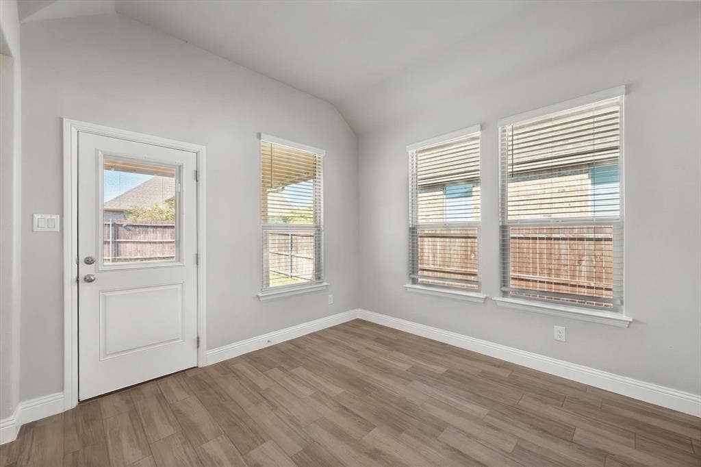 3636 Wintergreen Street, Grand Prairie, TX 76065 Bright breakfast area flooded with natural light through multiple casement windows