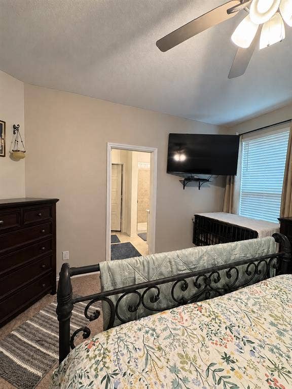 5719 Huffines Boulevard, Royse City, TX 75189 Carpeted room with a ceiling fan light fixture and a window with blinds and drapes