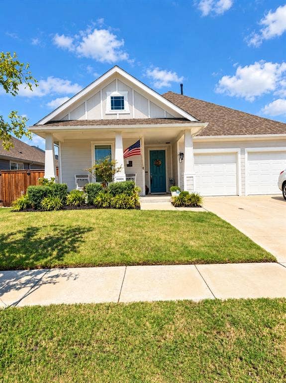 5719 Huffines Boulevard, Royse City, TX 75189 Front exterior with a covered porch, gabled roofline, and attached two-car garage