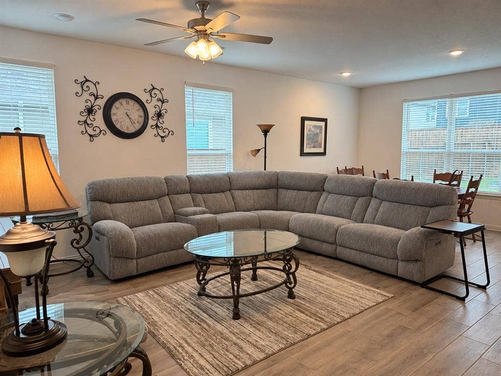 5719 Huffines Boulevard, Royse City, TX 75189 Recessed lighting, ceiling fan, wood-finish flooring, multiple windows with blinds, and an open-concept layout