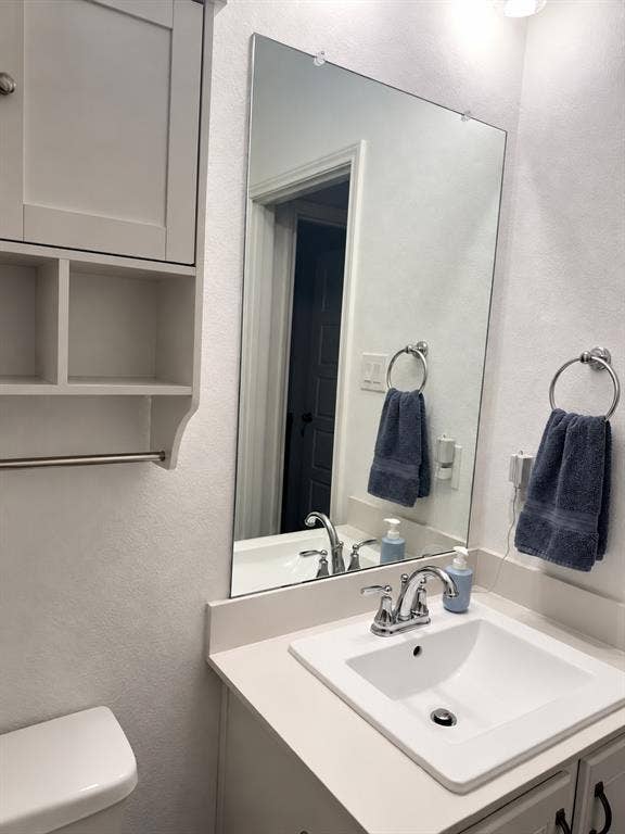 5719 Huffines Boulevard, Royse City, TX 75189 Vanity with an integrated rectangular sink, chrome-finish faucet, and light-toned countertop