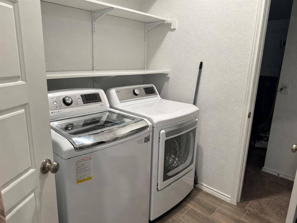 5719 Huffines Boulevard, Royse City, TX 75189 White wall-mounted shelving units, wood-finish flooring, and a white paneled door
