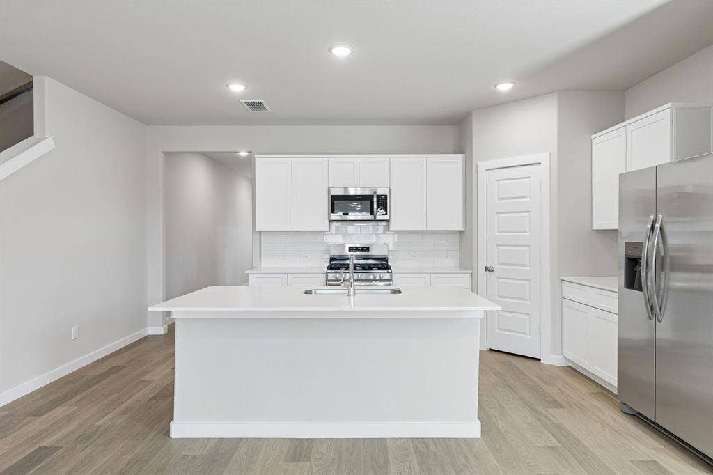 2308 Warm Glow Way, Princeton, TX 75407 Kitchen in the Holden home plan – REPRESENTATIVE PHOTO
