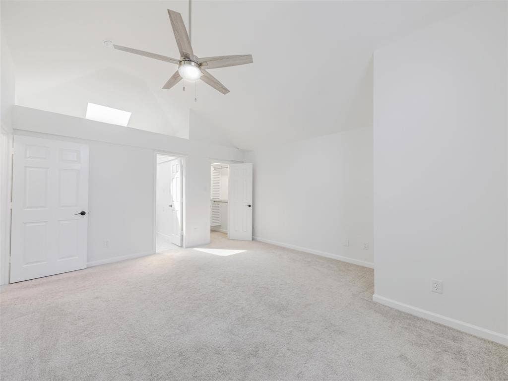 2327 N Ridge Road, McKinney, TX 75072 Vaulted ceilings featuring a skylight and a ceiling fan