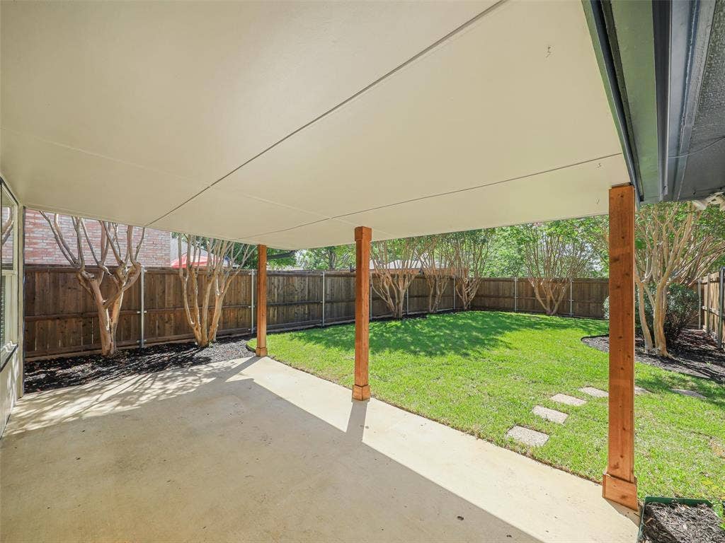 2327 N Ridge Road, McKinney, TX 75072 Covered concrete patio with wood support columns