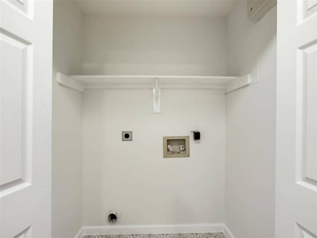 2327 N Ridge Road, McKinney, TX 75072 White wall paint, built-in shelving, patterned floor tile, and panel doors