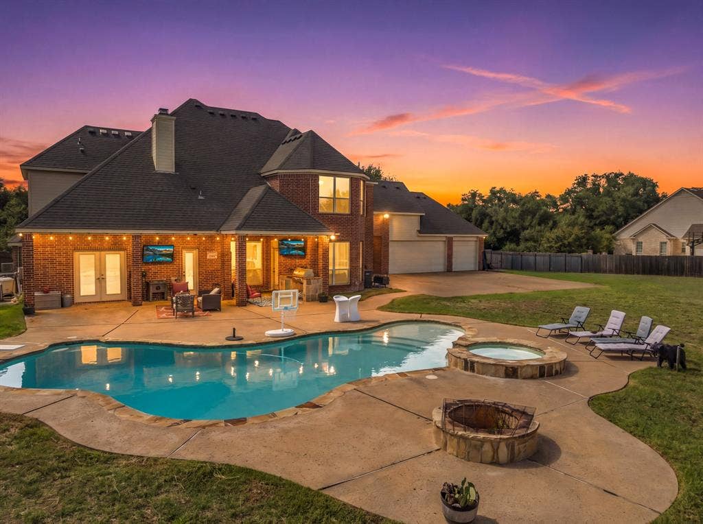 1021 Cascade Trail, McGregor, TX 76657 Brick exterior with multiple windows