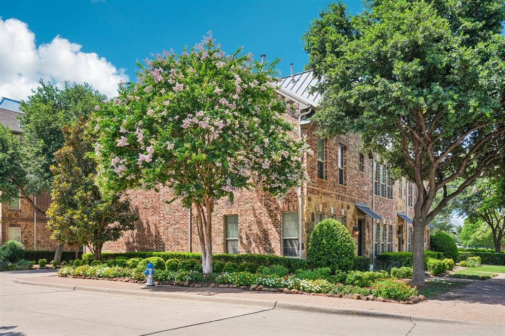7937 Parkwood Boulevard, Plano, TX 75024 Brick and stone facade with multiple window configurations