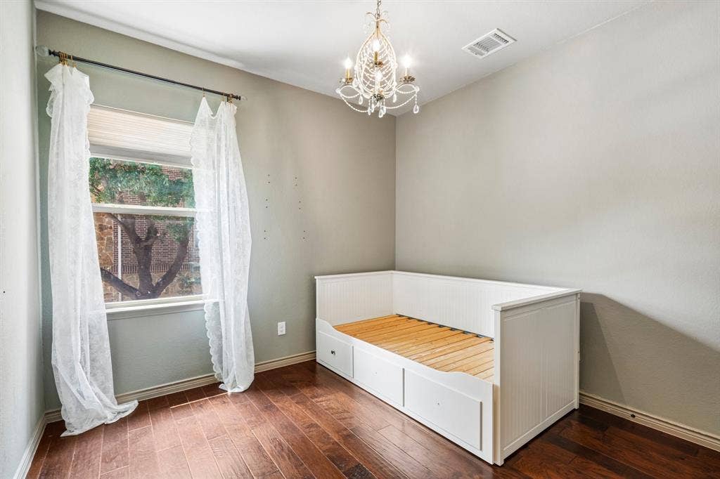 7937 Parkwood Boulevard, Plano, TX 75024 Hardwood-style flooring, white built-in daybed with integrated storage, single window with blinds, and a decorative chandelier