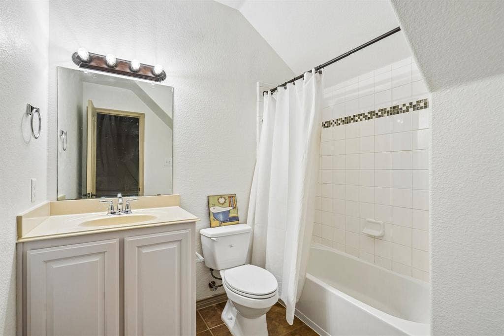 7937 Parkwood Boulevard, Plano, TX 75024 White tile shower with decorative accent border