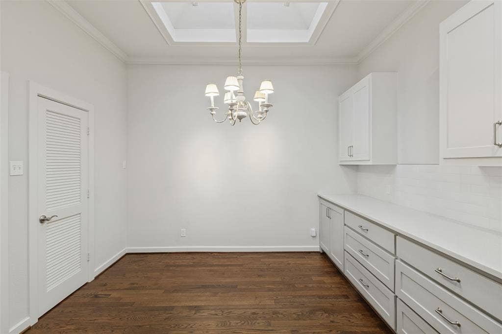 In back of open kitchen with adjacent walk-in pantry