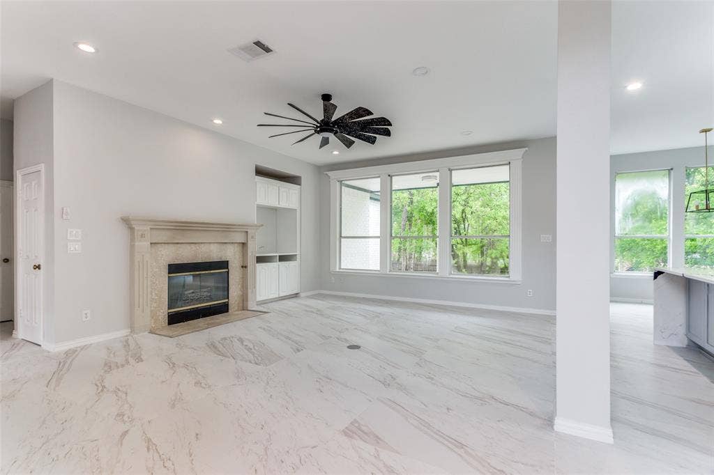 6315 Millwood Court, Arlington, TX 76016 Recessed lighting, ceiling fan, fireplace with mantel, built-in cabinetry, and large windows