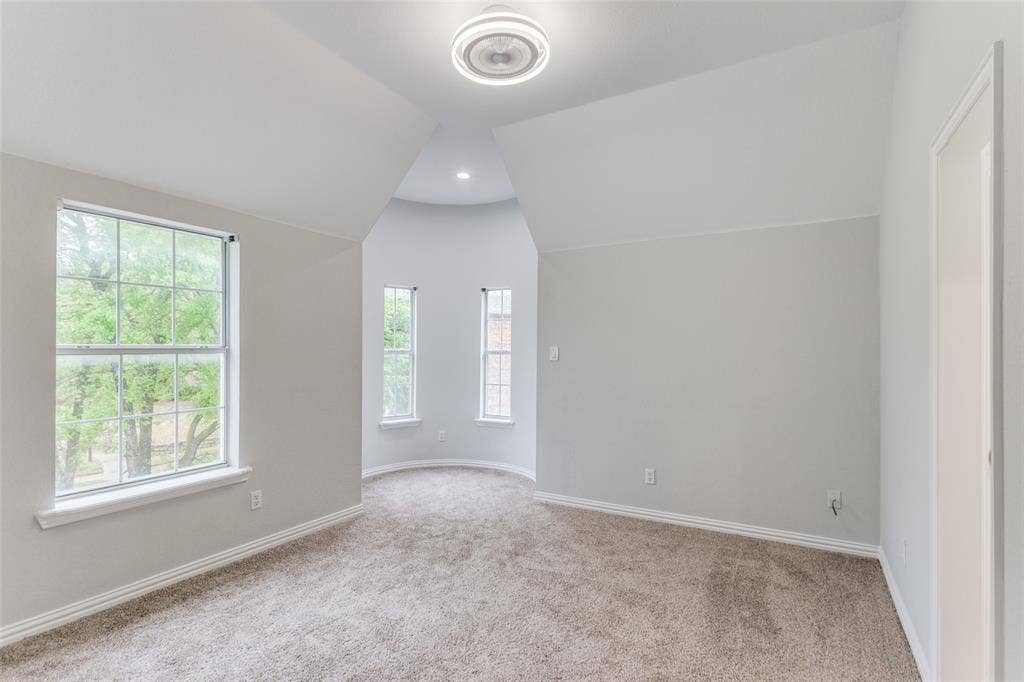 6315 Millwood Court, Arlington, TX 76016 Carpeted room with multiple windows, a recessed lighting fixture, and a ceiling-mounted light fixture