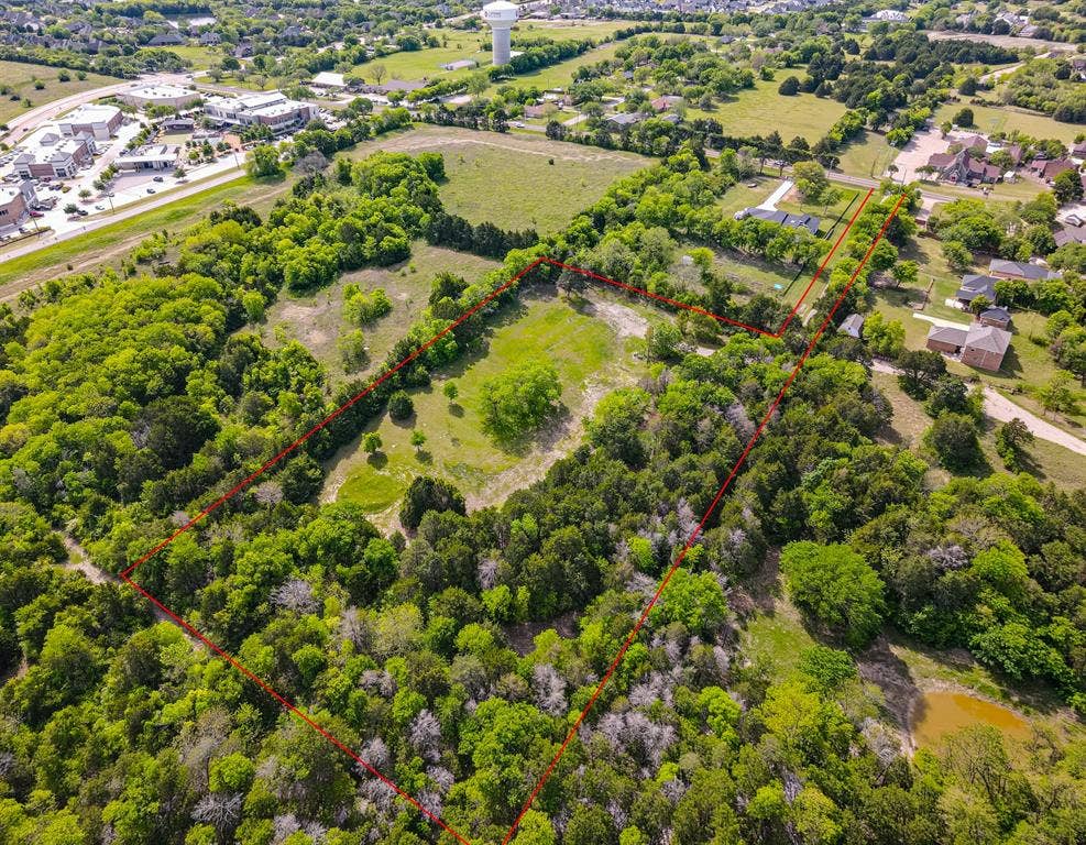 1603 Smirl Drive, Heath, TX 75032 Expansive wooded property featuring mature trees, open green space, and natural landscape throughout