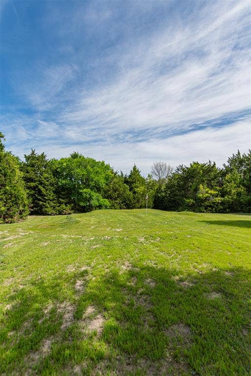 1603 Smirl Drive, Heath, TX 75032 Expansive grassy area with lush perimeter trees