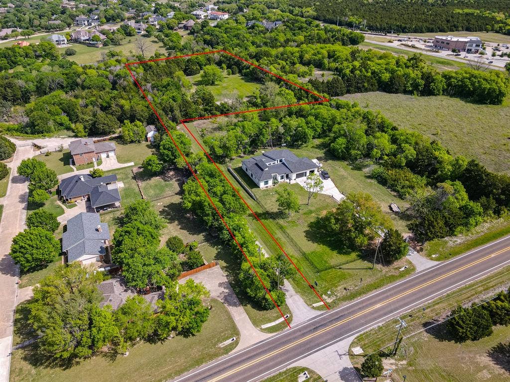 1603 Smirl Drive, Heath, TX 75032 Expansive treed lot with a paved road frontage
