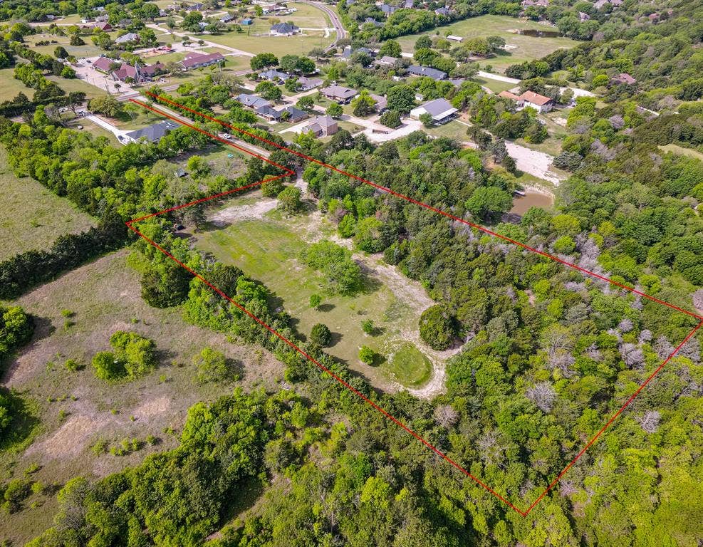 1603 Smirl Drive, Heath, TX 75032 Expansive lot featuring a combination of cleared land and mature trees