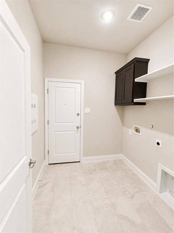 6002 14th Street, Midlothian, TX 76065 Utility space featuring light-toned tile flooring and painted walls