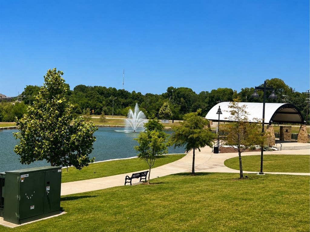 6002 14th Street, Midlothian, TX 76065 Landscaped park area featuring a central pond with a fountain