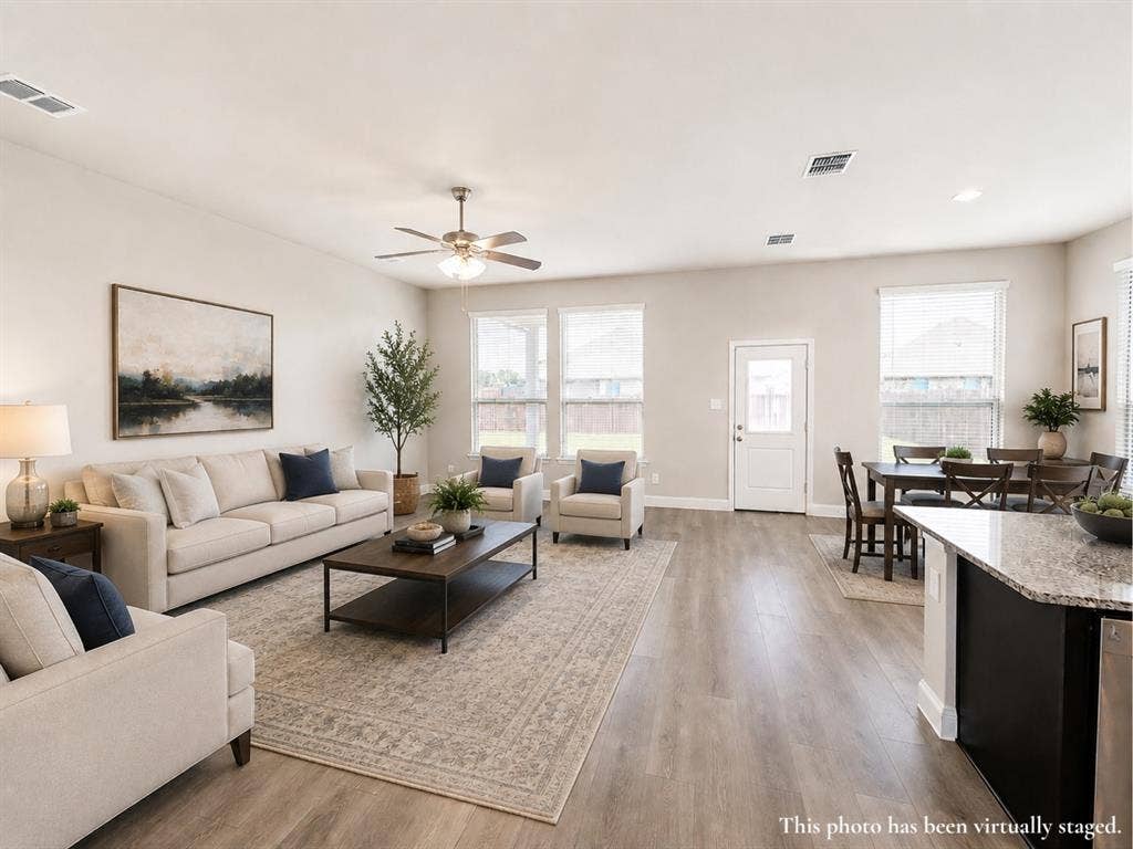 6002 14th Street, Midlothian, TX 76065 Open-concept living space featuring wood-finish flooring, recessed lighting, and a ceiling fan