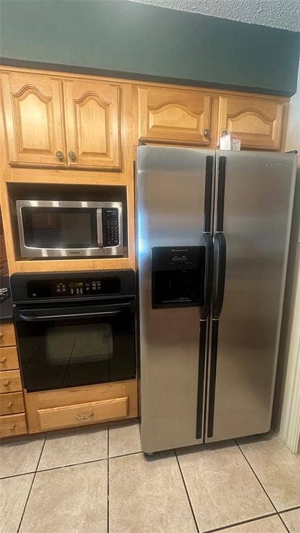 Stainless steel side-by-side refrigerator, microwave, and oven