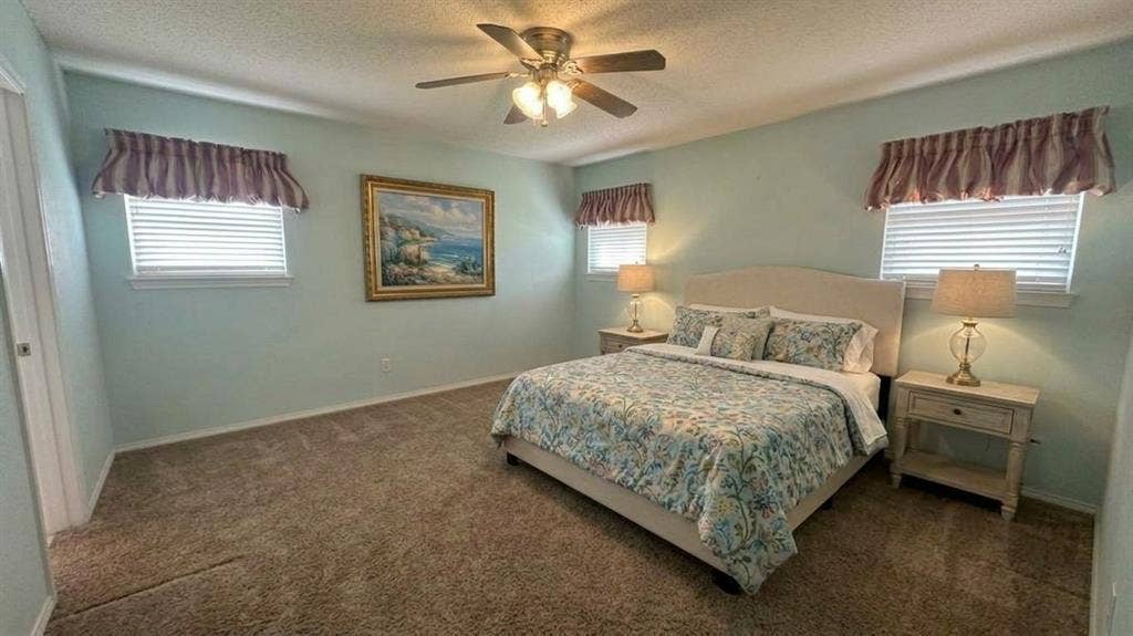 Staged AI furniture; -nice size suite with 3 windows & blinds.