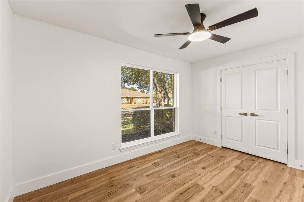 2716 Landershire Lane, Plano, TX 75023 Recessed ceiling fan with integrated lighting, wood-finish flooring, and white paneled double doors