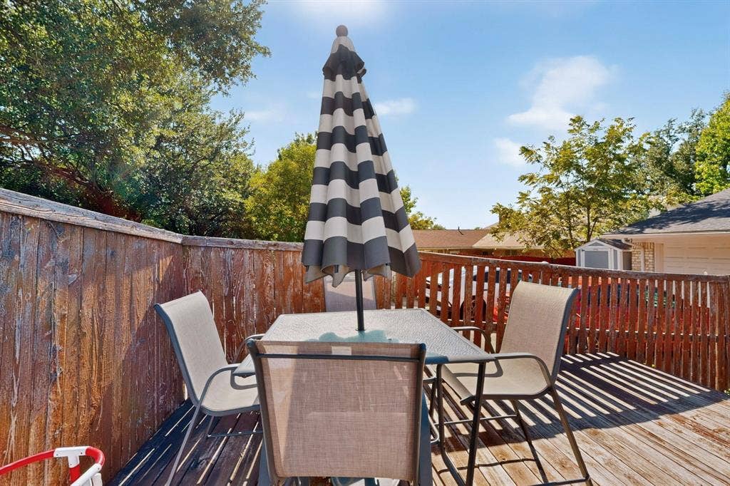 1418 Stony Brook Lane, Garland, TX 75043 Wood-plank outdoor deck with perimeter fencing