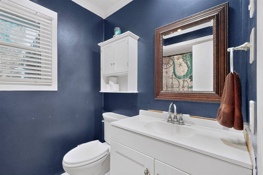 1418 Stony Brook Lane, Garland, TX 75043 White vanity with integrated sink, chrome faucet, and white countertop