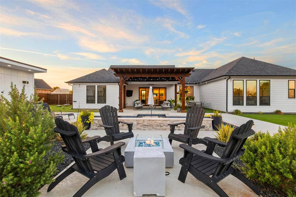 1220 Lynn Way, Waxahachie, TX 75165 Dedicated fire-pit seating area beside the pool and landscaped grounds.