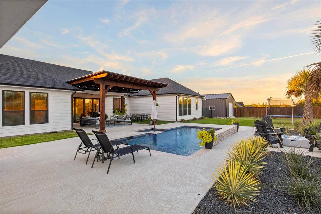 1220 Lynn Way, Waxahachie, TX 75165 The pool, outdoor living area and separate pool house create a backyard designed to be enjoyed.